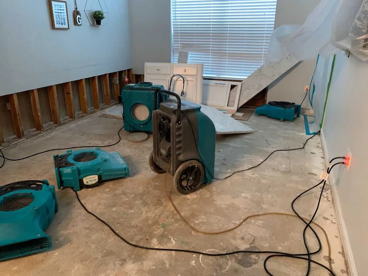 Dehumidifier in flood-cut room for Water Damage Restoration in Lima